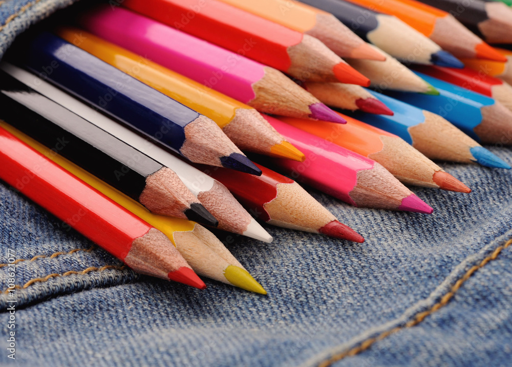 set of multicolored pencils in blue jeans pocket set of multicolored pencils in blue jeans pocket