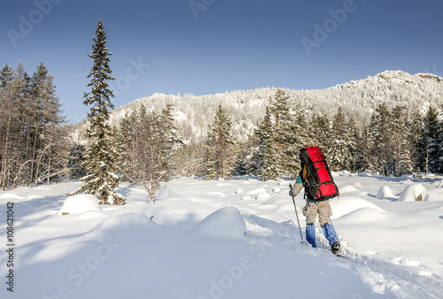 Hiker in winter mountains