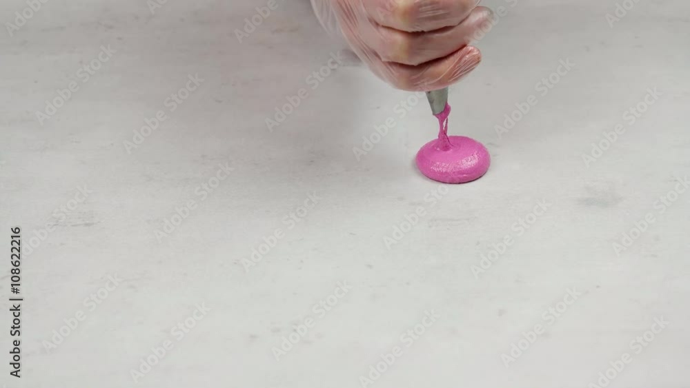 Process of applying Macaroons dough on the cooking tray Process of applying Macaroons dough on the cooking tray