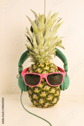 Pineapple wearing sunglasses and headphones