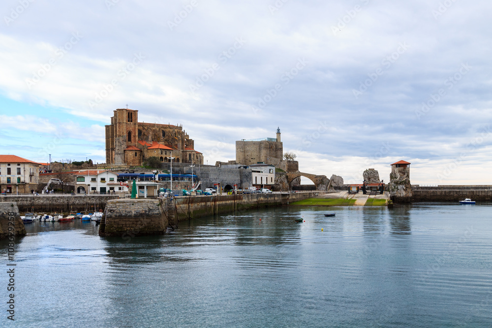 Panoramic of Castro Urdiales, with the church of Santa Maria de la Asuncion and Castle Lighthouse in the background