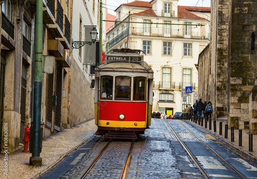 Romantic Lisbon street with the typical tram and Lisbon 