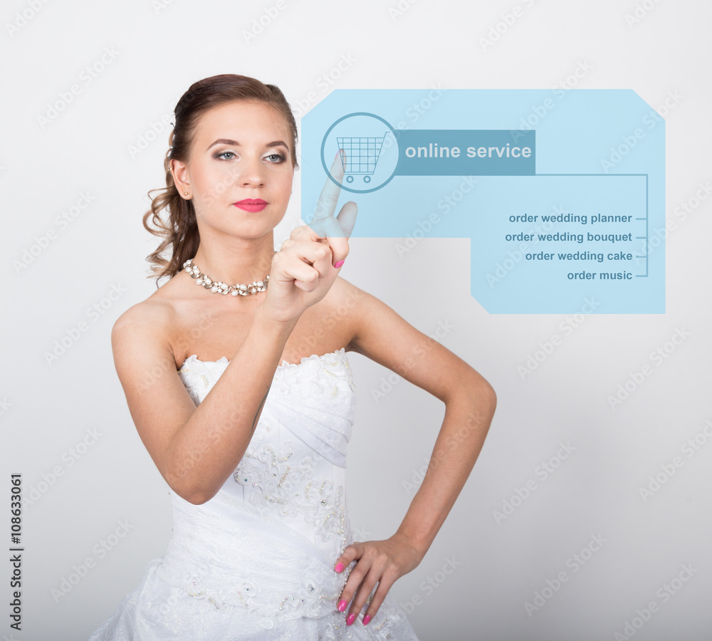 technology, internet and networking concept. Beautiful bride with fashion wedding hairstyle. Bride presses online service button on virtual screens technology, internet and networking concept. Beautiful bride with fashion wedding hairstyle. Bride presses online service button on virtual screens