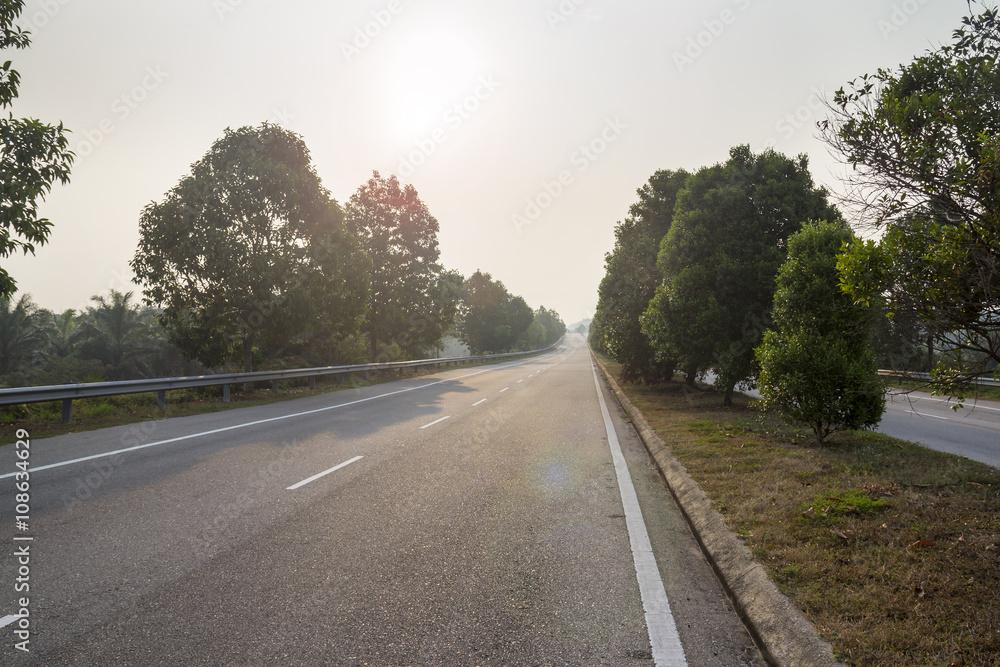 Fototapeta premium Empty highway road blue sky in sunrise morning, rural countryside speedway route for motion trip