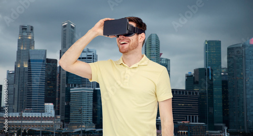 happy man in virtual reality headset or 3d glasses