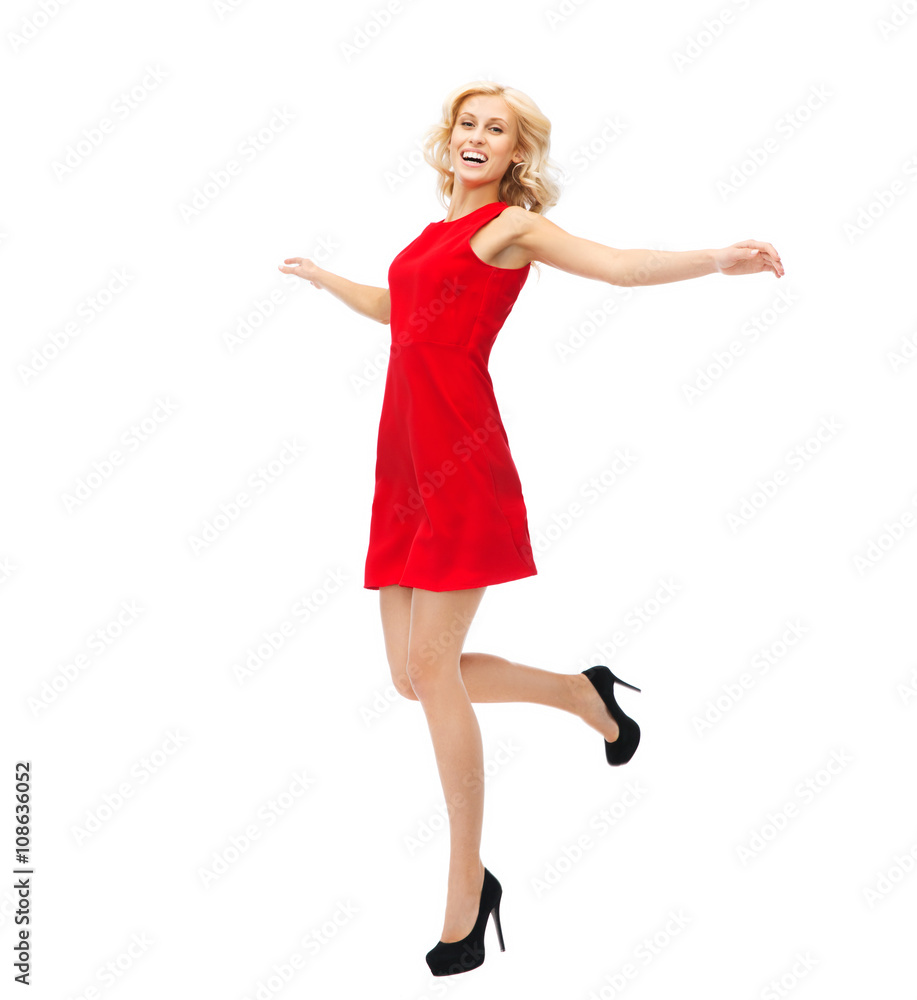 happy young woman in red dress jumping high happy young woman in red dress jumping high