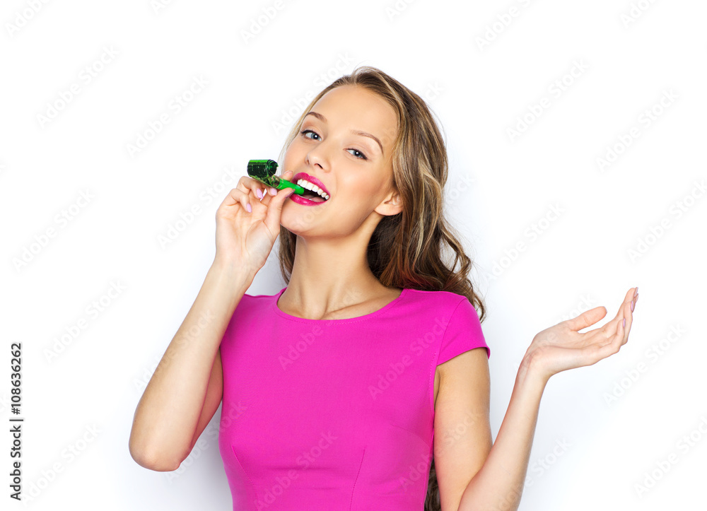 happy young woman or teen girl with party horn happy young woman or teen girl with party horn