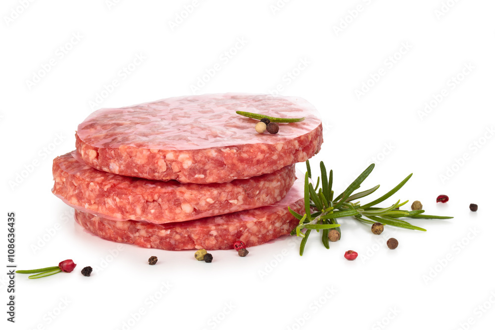 Raw hamburgers and spices. Raw hamburgers and spices.