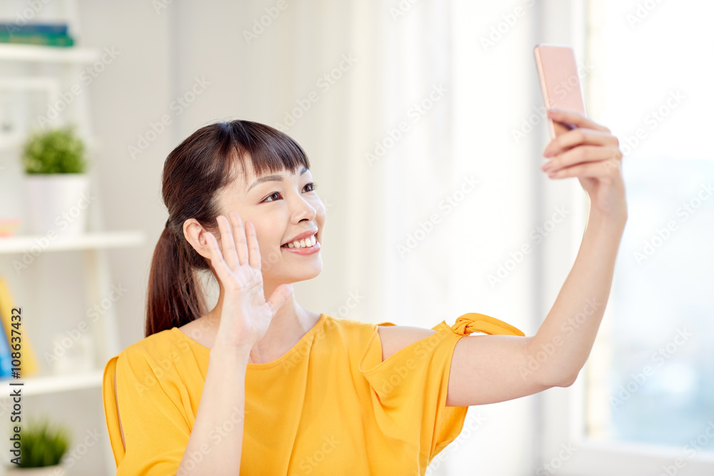happy asian woman taking selfie with smartphone happy asian woman taking selfie with smartphone