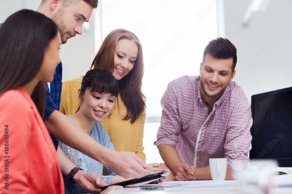 happy creative team with tablet pc at office happy creative team with tablet pc at office