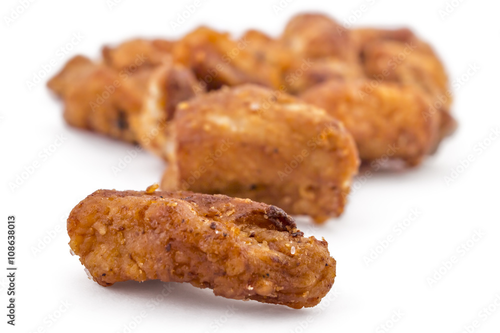 Heap of domestic salty fried pork greaves, cvarci, isolated on white, macro closeup Heap of domestic salty fried pork greaves, cvarci, isolated on white, macro closeup