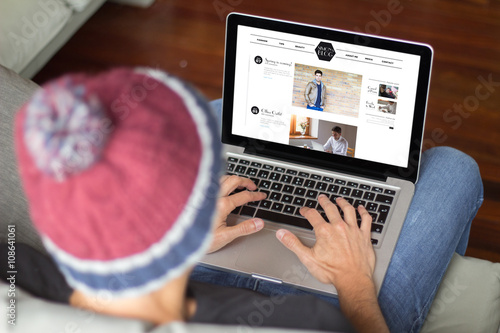 Photography Young man on the sofa surfing internet