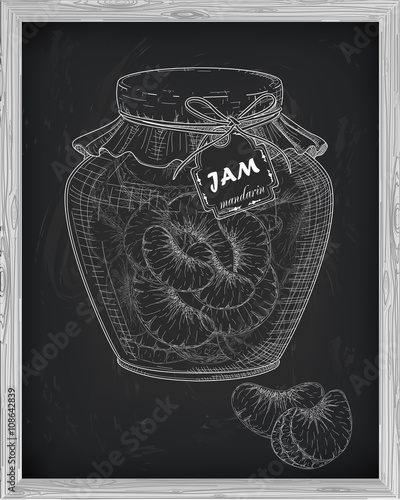 beautiful jar of homemade jam with mandarin on a black backgroun