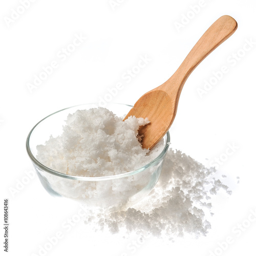 white salt in wooden spoon