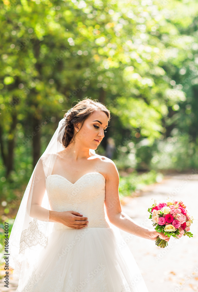 Wedding flowers ,Woman holding colorful bouquet with her hands on wedding day Wedding flowers ,Woman holding colorful bouquet with her hands on wedding day