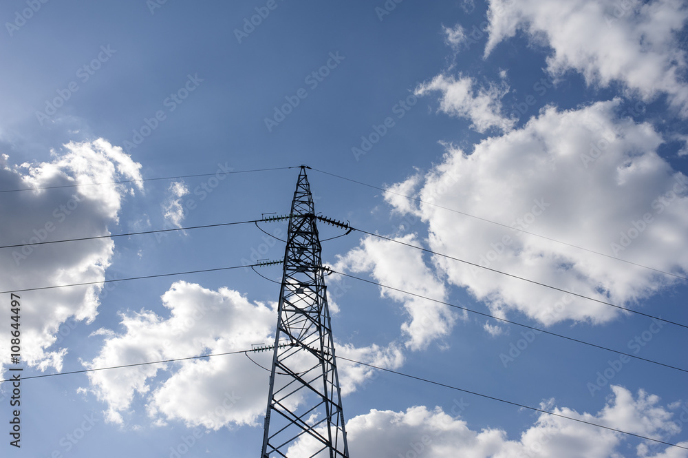 Electricity transmission pylon silhouetted against blue sky Electricity transmission pylon silhouetted against blue sky