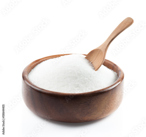 White sugar in wood bowl on white background