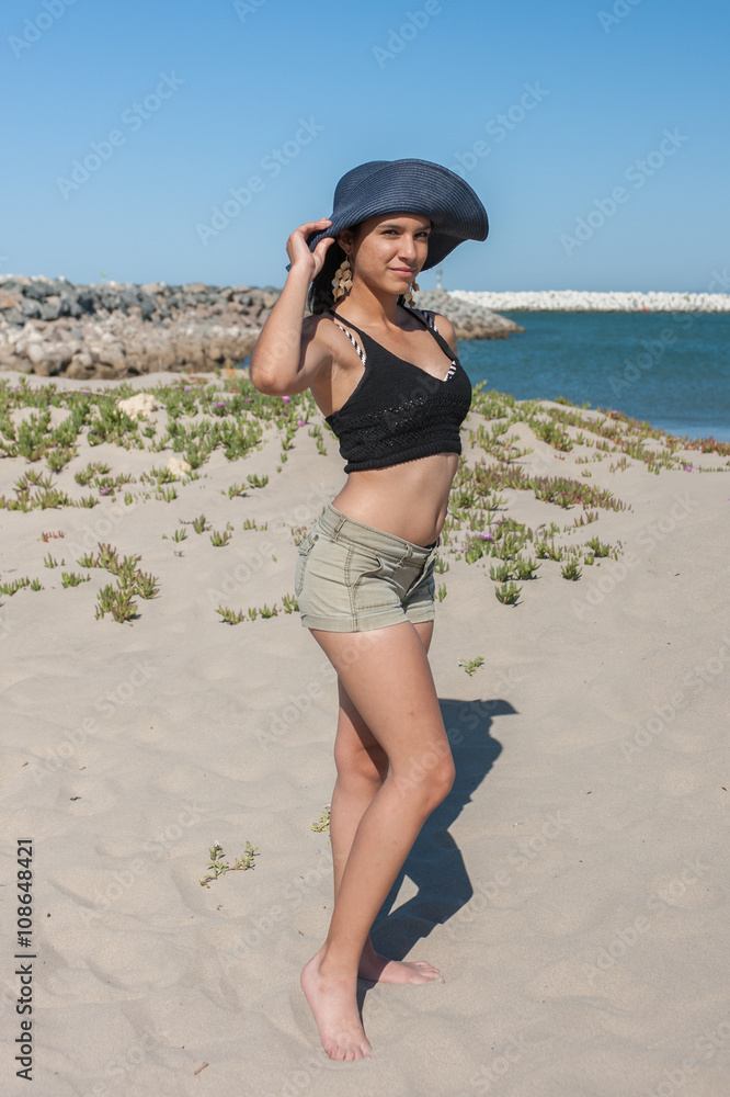 Toned Latina woman in full body pose at Ventura Cove. Stock Photo