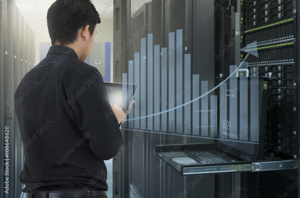 Man working in data center and use tablet for analyze system Man working in data center and use tablet for analyze system