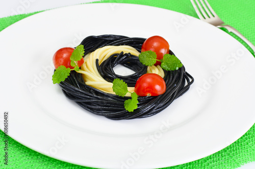 Black Spaghetti with Cuttlefish Ink, Tomato and Basil. Mediterra photo