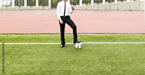 European Football Championship concept. Businessman playing soccer ball.
