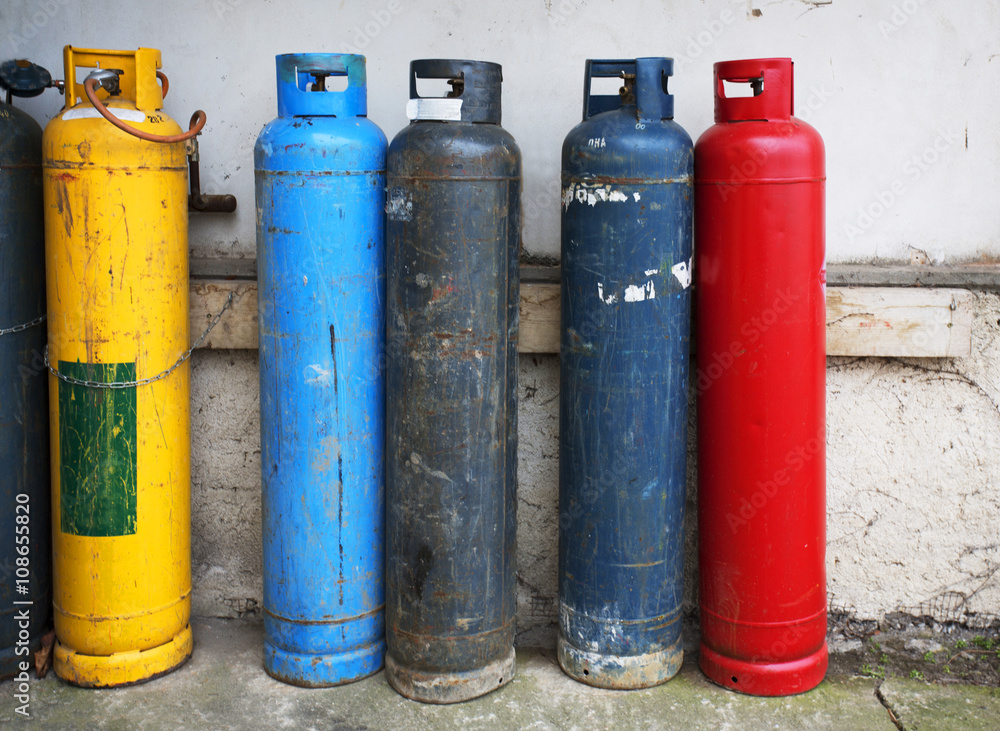 Gas cylinder. Industrial propane butane bombs. Row dirty gas cylinders. Yellow chemical bomb. Corroded welder container. Old heating bombs with valve. Pressurized container. Dangerous equipment. Gas cylinder. Industrial propane butane bombs. Row dirty gas cylinders. Yellow chemical bomb. Corroded welder container. Old heating bombs with valve. Pressurized container. Dangerous equipment.