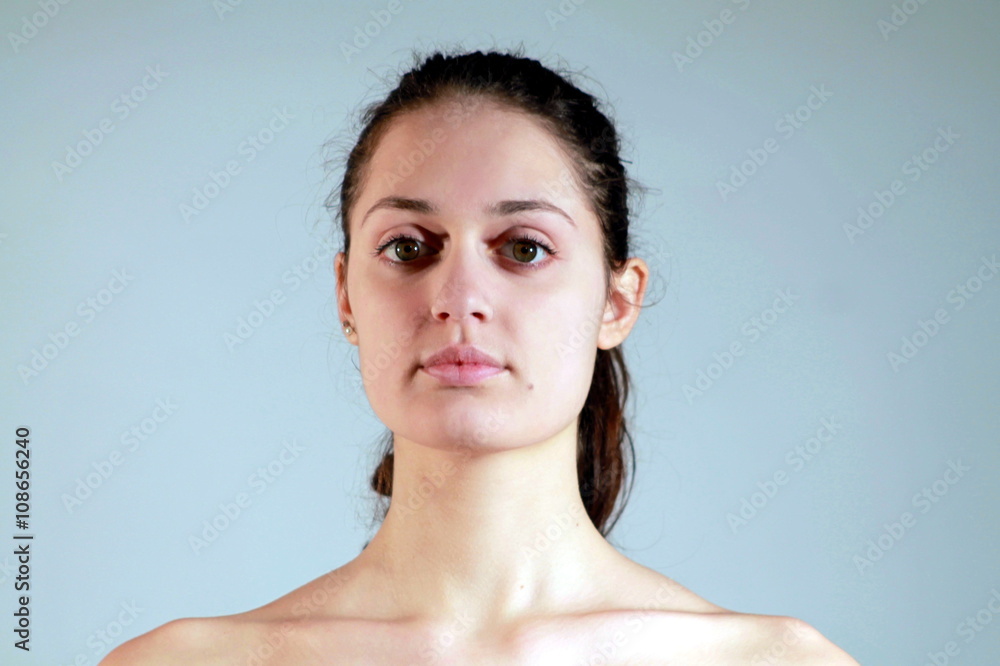 Beautiful young woman with only pancake on her face Beautiful young woman with only pancake on her face