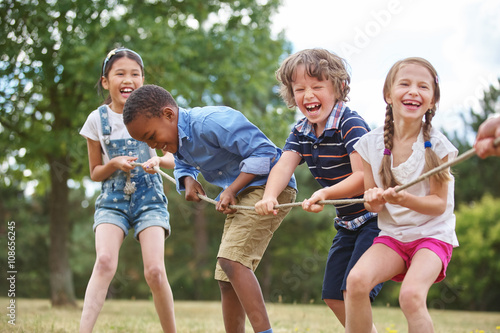 Children playing tug of war photo