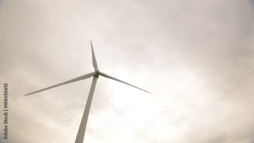 Engineer Inspecting Wind Turbine Engineer Inspecting Wind Turbine