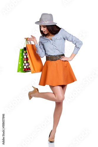 woman with shopping bags. Studio shoot