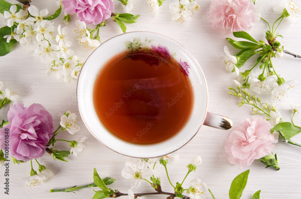 Tea with cherry blossom flowers, macaroons. Spring concept Tea with cherry blossom flowers, macaroons. Spring concept