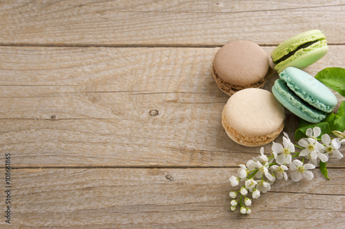 French macaroons on a vintage background. Turquoise, chocolate a