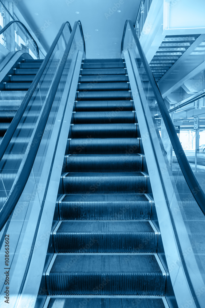 Up and down escalators in public building Up and down escalators in public building