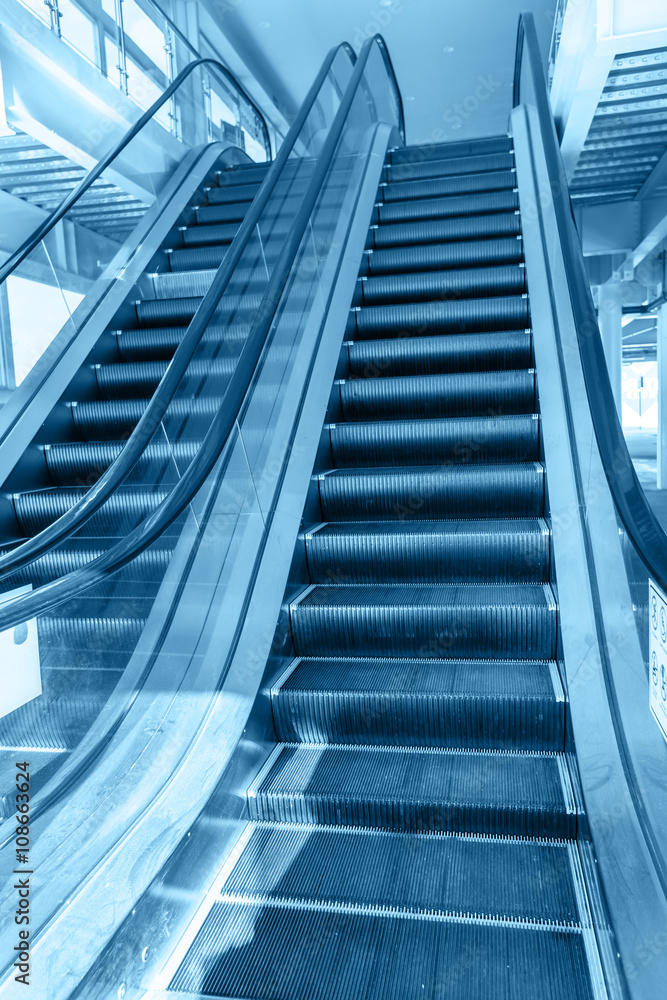 Up and down escalators in public building Up and down escalators in public building