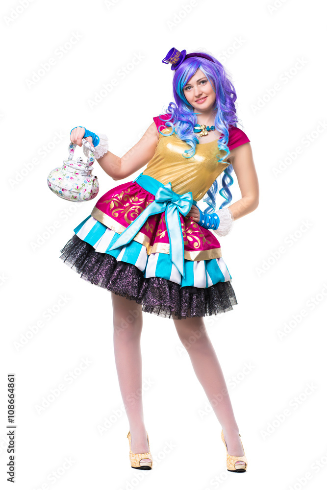 Smiling woman wearing colorful dress and blue wig Smiling woman wearing colorful dress and blue wig