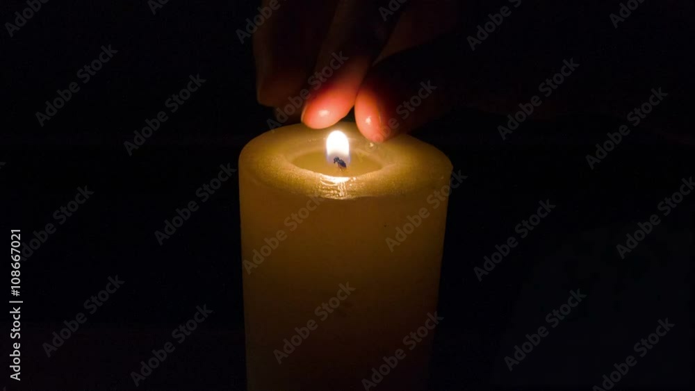hand of person putting out the candle hand of person putting out the candle