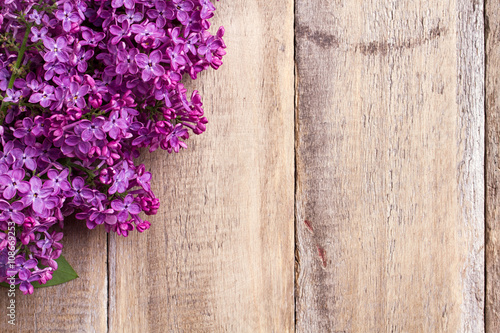 lilac flowers on a old wooden background