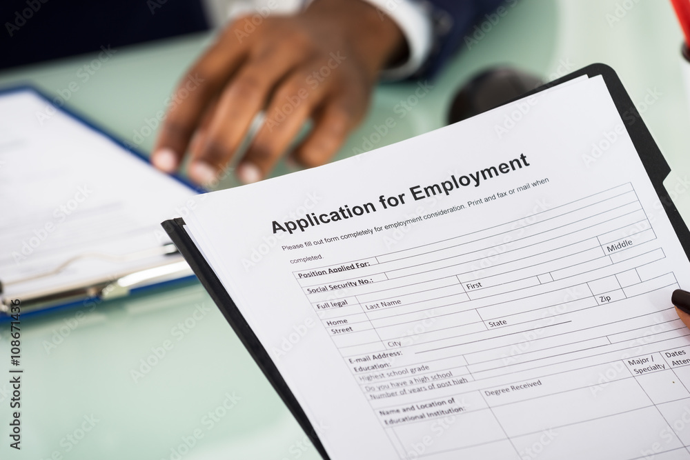 Female Candidate Holding Application Form Female Candidate Holding Application Form