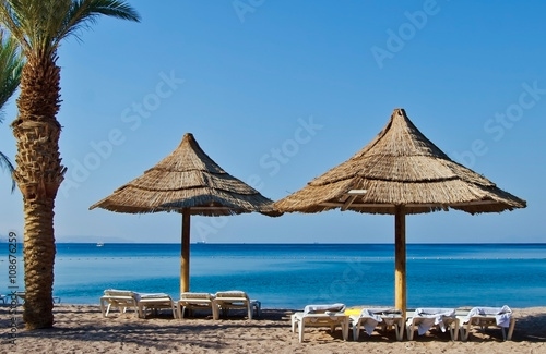 Relaxing facilities on the golden beach of Eilat - famous resort city in Israel