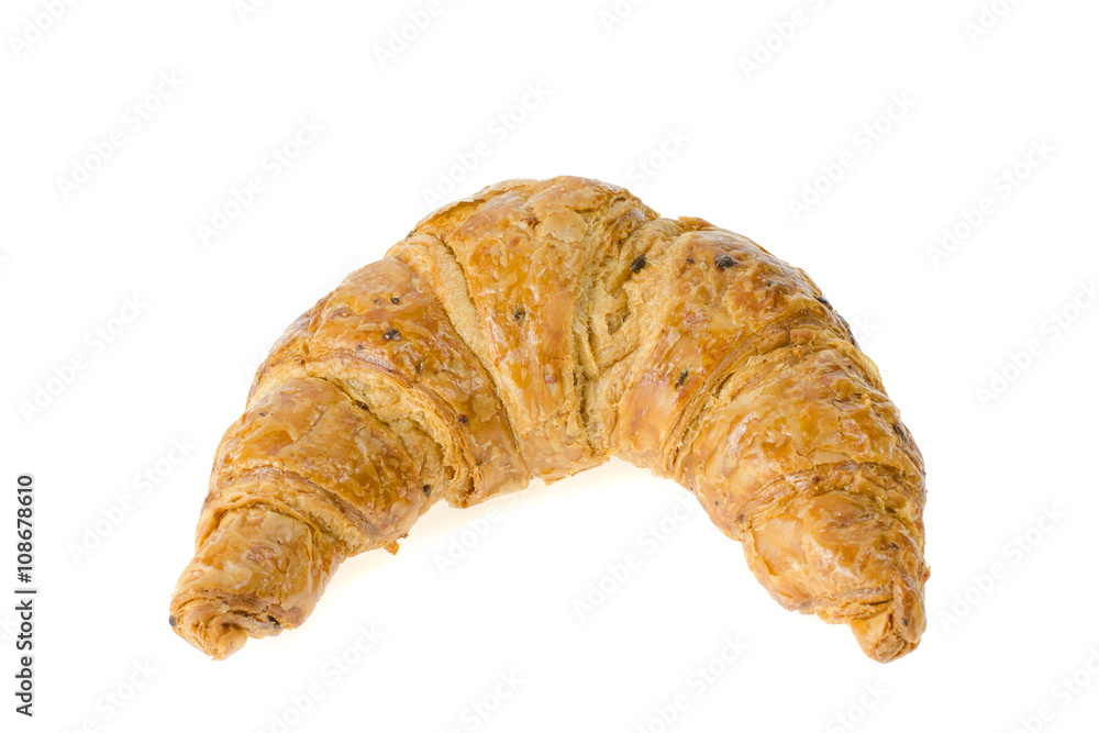 fresh croissant with nuts and raisins on white