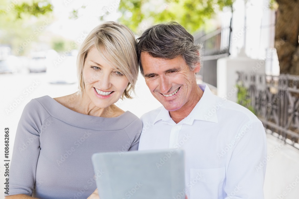 Happy couple using digital tablet Happy couple using digital tablet