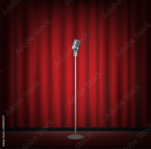 microphone stand on a stage with red curtain backgrond
