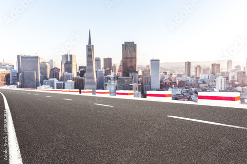 asphalt road with cityscape and skyline of san francisco
