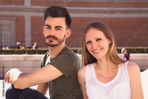 Portrait of a smiling young couple in the city