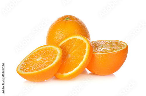 whole and sliced ripe orange on white background