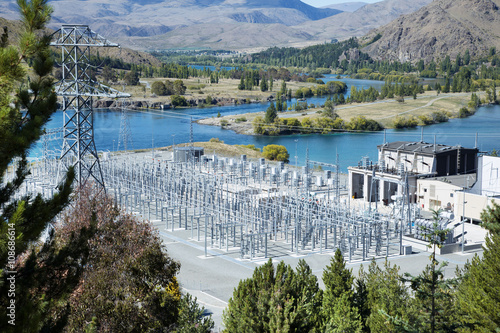 Obraz na plátne power substation on the side of river and mountains