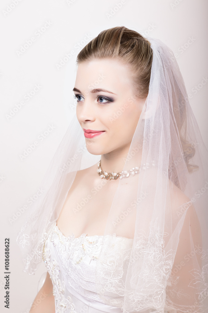Beautiful bride with fashion wedding hairstyle. Close-up portrait of young gorgeous bride. Wedding. Beautiful bride with fashion wedding hairstyle. Close-up portrait of young gorgeous bride. Wedding.