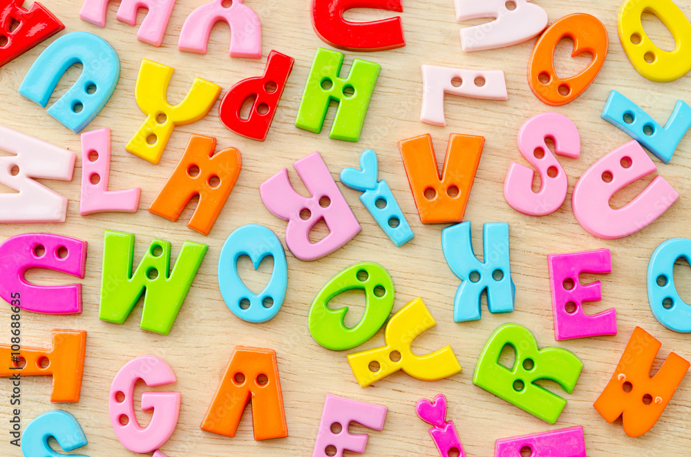 Naklejka premium Untidy collection of plastic alphabet letters, school education