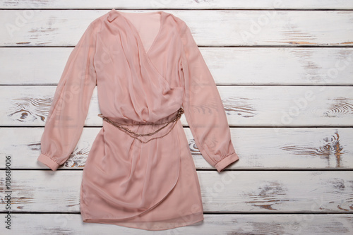 Slika na platnu Peach dress with long sleeves.