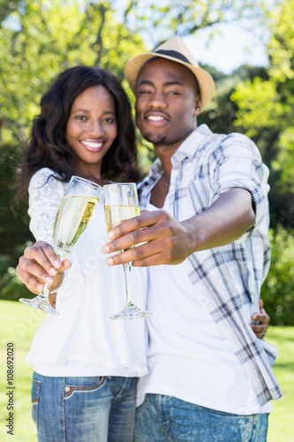 Young couple toasting glasses of champagne